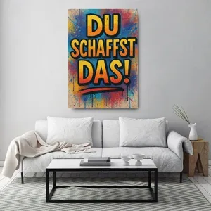 Kunstdruck du schaffst das gelb – Gelb-orange Blockbuchstaben mit schwarzer Kontur rufen „DU SCHAFFST DAS!“, darunter ein roter Pinselstrich, rundherum Farbspritzer in Blau, Rot und Gelb